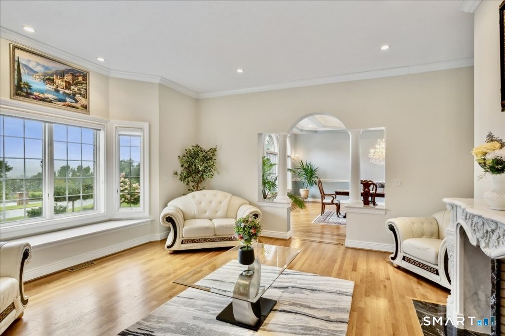 24 Hunting Ridge Drive Simsbury, CT 06070 - Photo 8 of 35 a living room with furniture and a large window