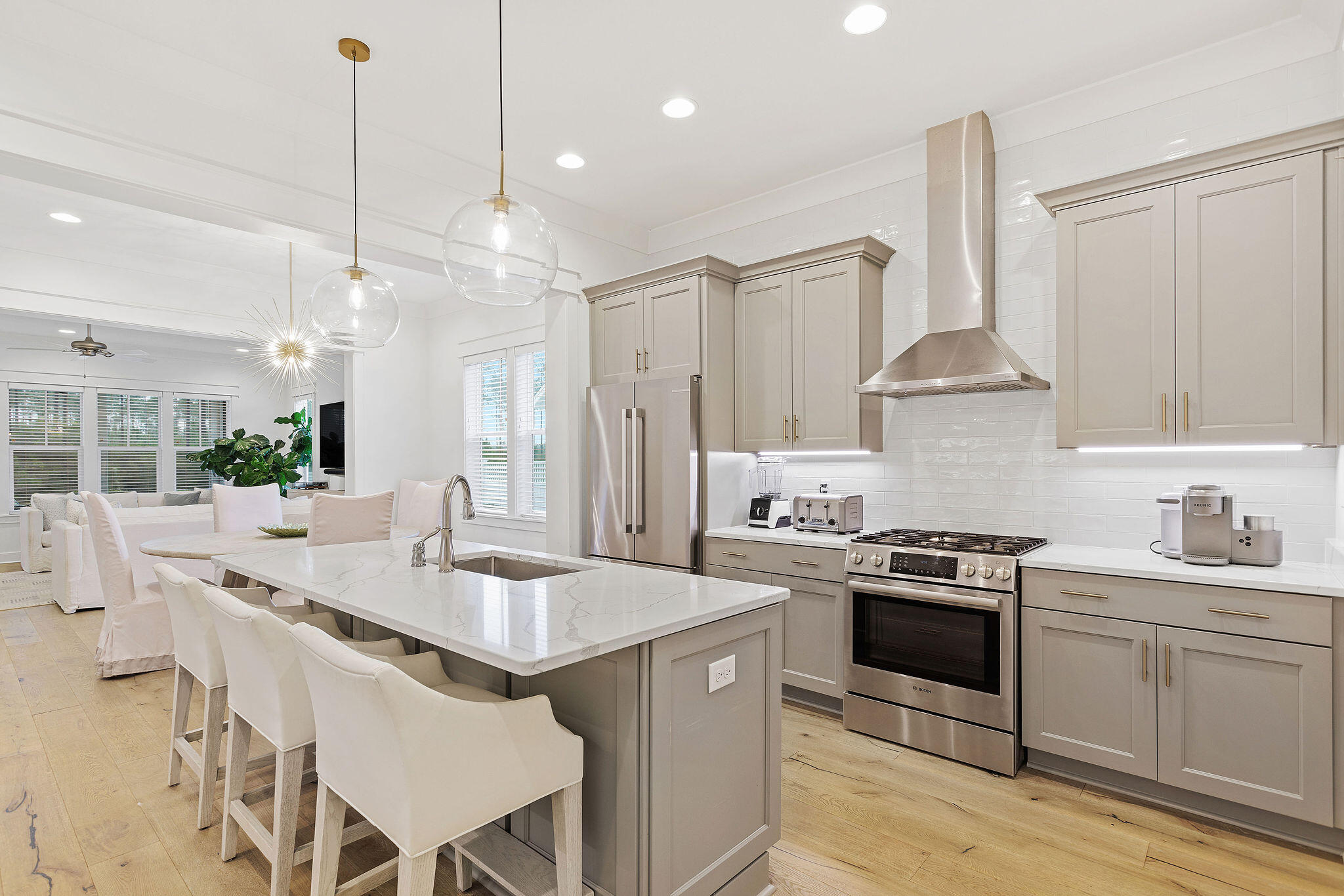 309 Sidecamp Road Watersound, FL 32461 - Photo 1 of 26 a kitchen with kitchen island a stove a sink a stove and a refrigerator