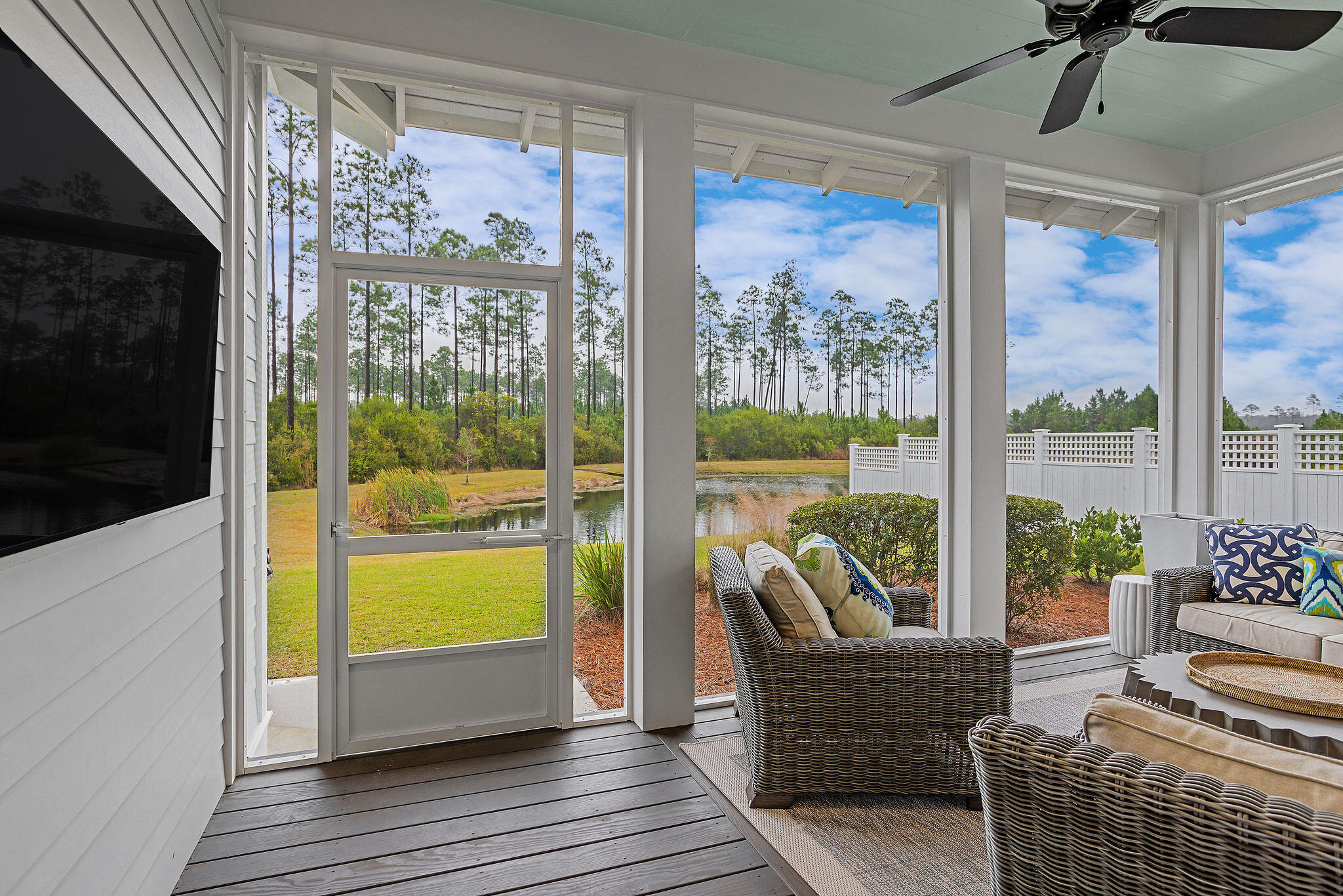 309 Sidecamp Road Watersound, FL 32461 - Photo 11 of 26 a living room with furniture and a floor to ceiling window