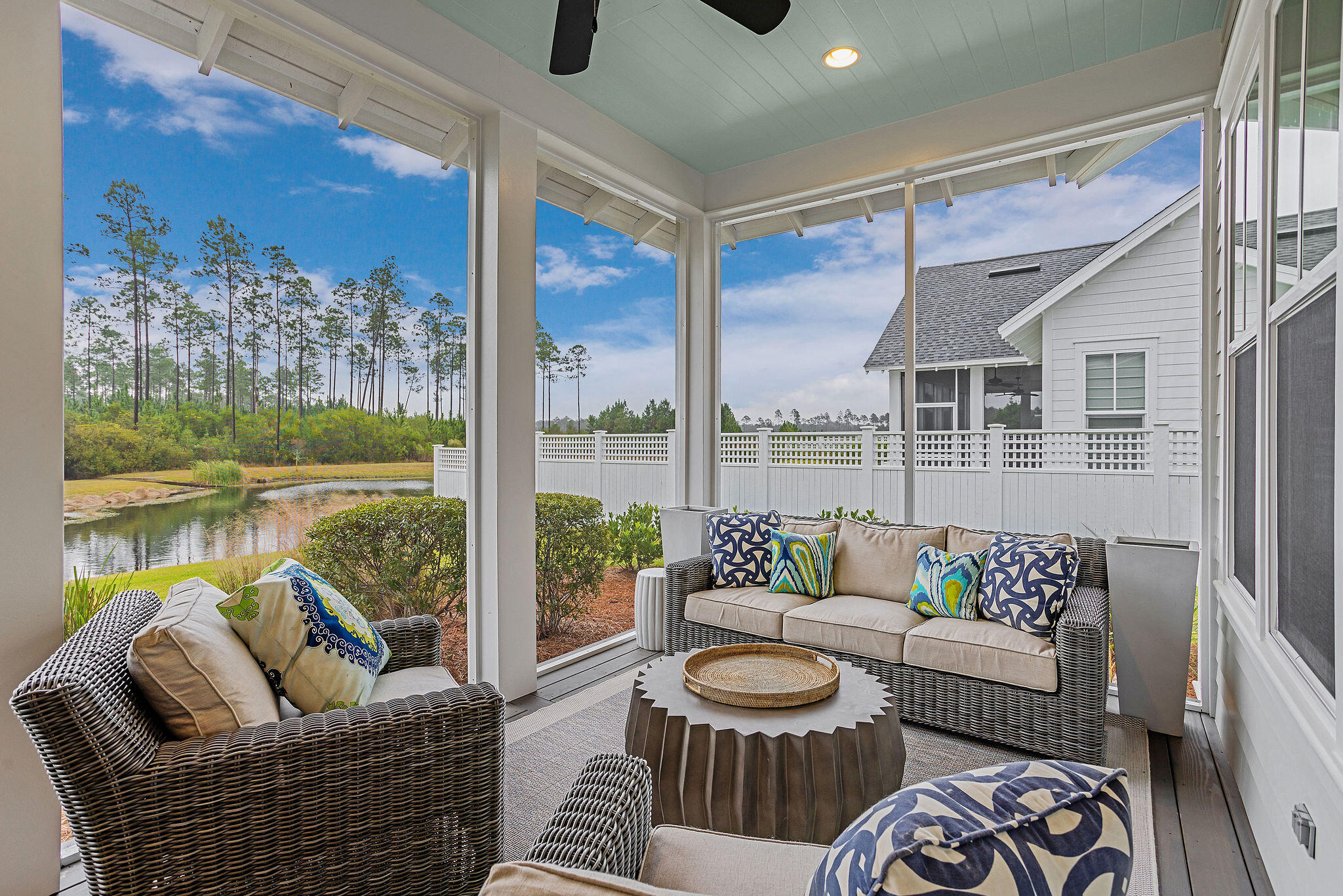 309 Sidecamp Road Watersound, FL 32461 - Photo 12 of 26 a living room with furniture and a floor to ceiling window