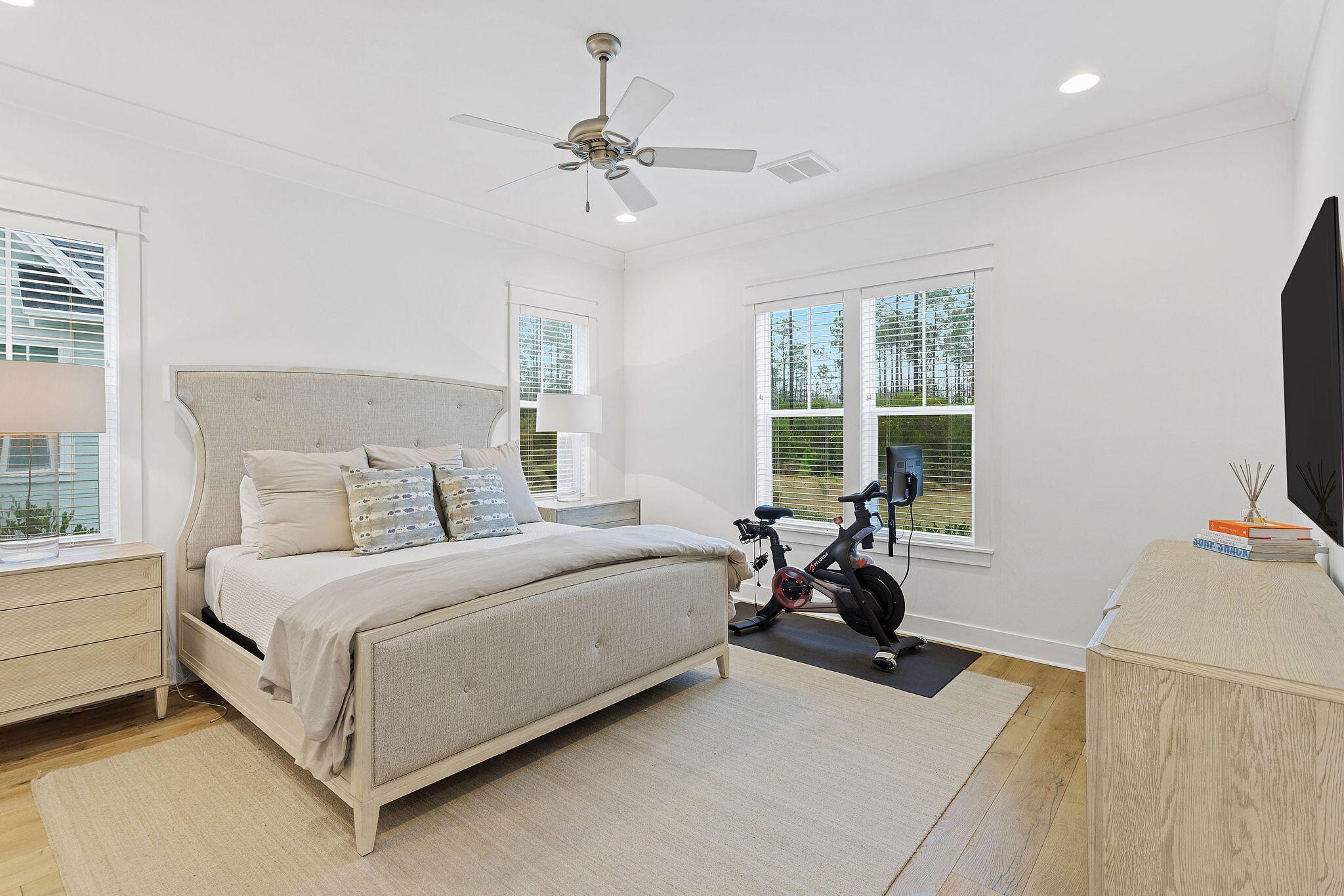 309 Sidecamp Road Watersound, FL 32461 - Photo 13 of 26 a bedroom with a bed and a chandelier