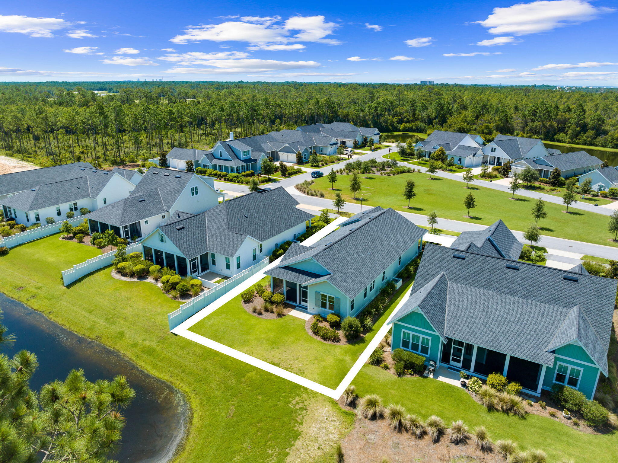 309 Sidecamp Road Watersound, FL 32461 - Photo 20 of 26 an aerial view of a house with a swimming pool outdoor seating and yard