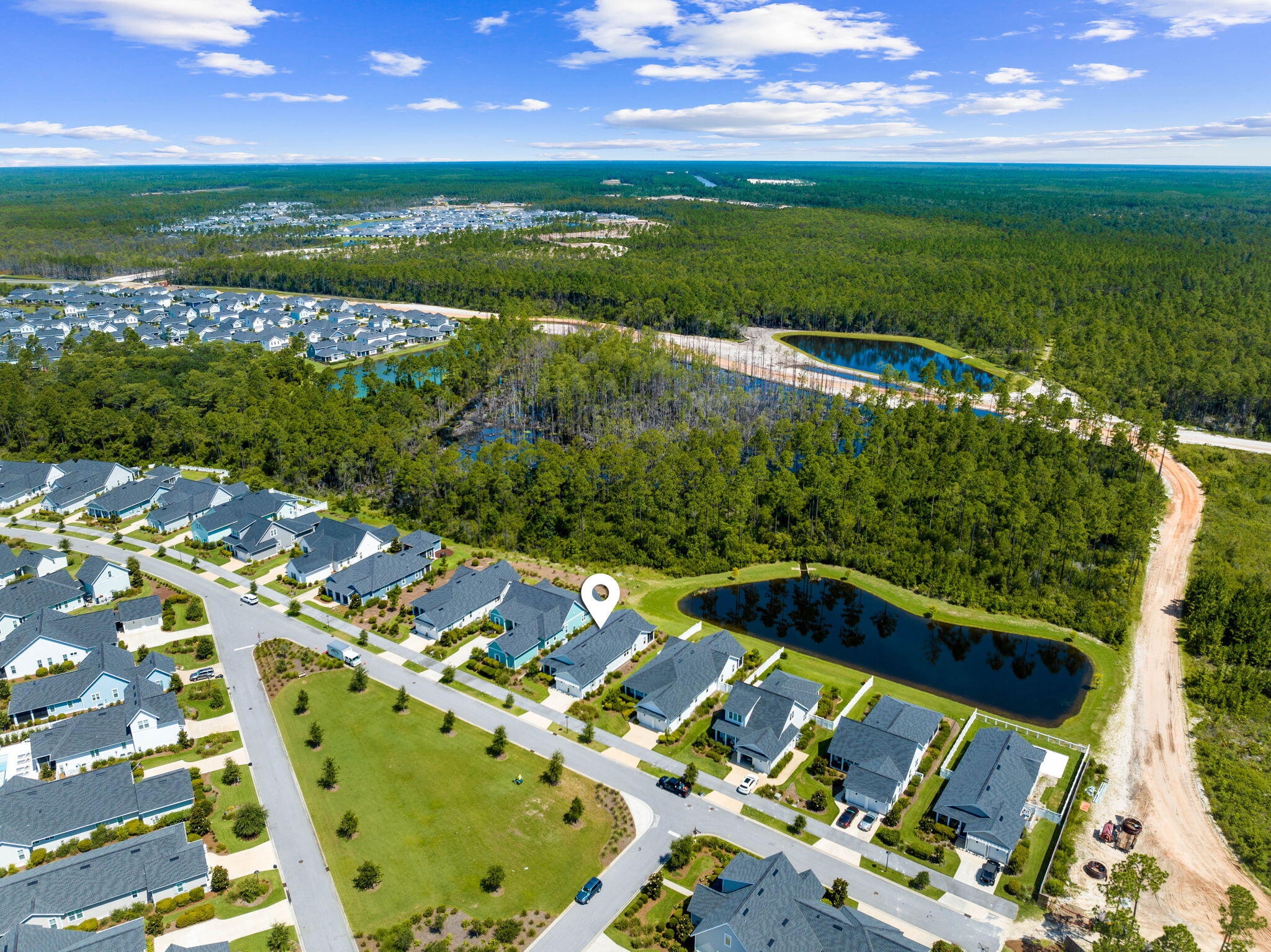 309 Sidecamp Road Watersound, FL 32461 - Photo 3 of 26 a view of a lake with a big yard