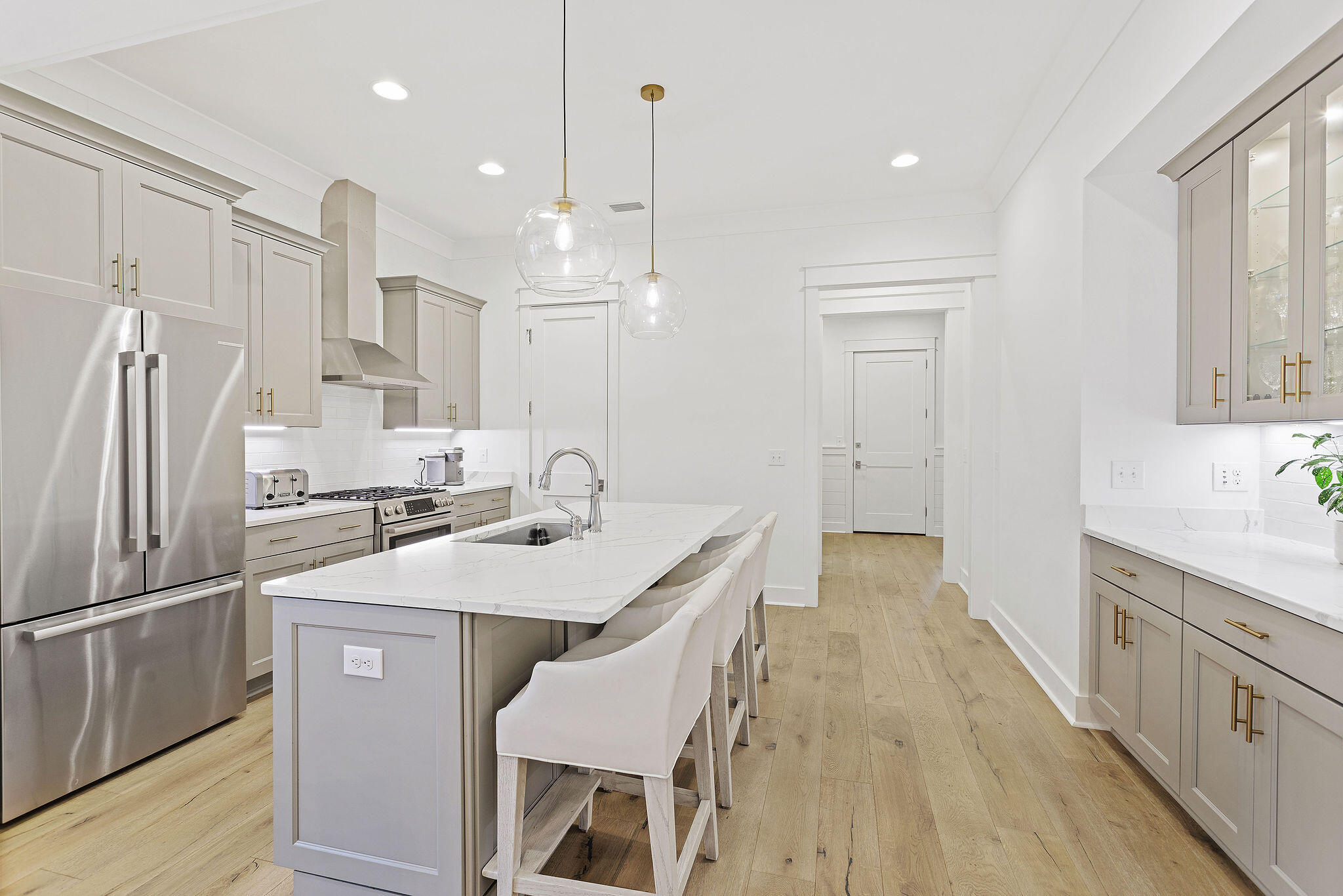 309 Sidecamp Road Watersound, FL 32461 - Photo 7 of 26 a kitchen with counter top space sink stove and refrigerator