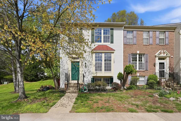a front view of a house with outdoor seating yard
