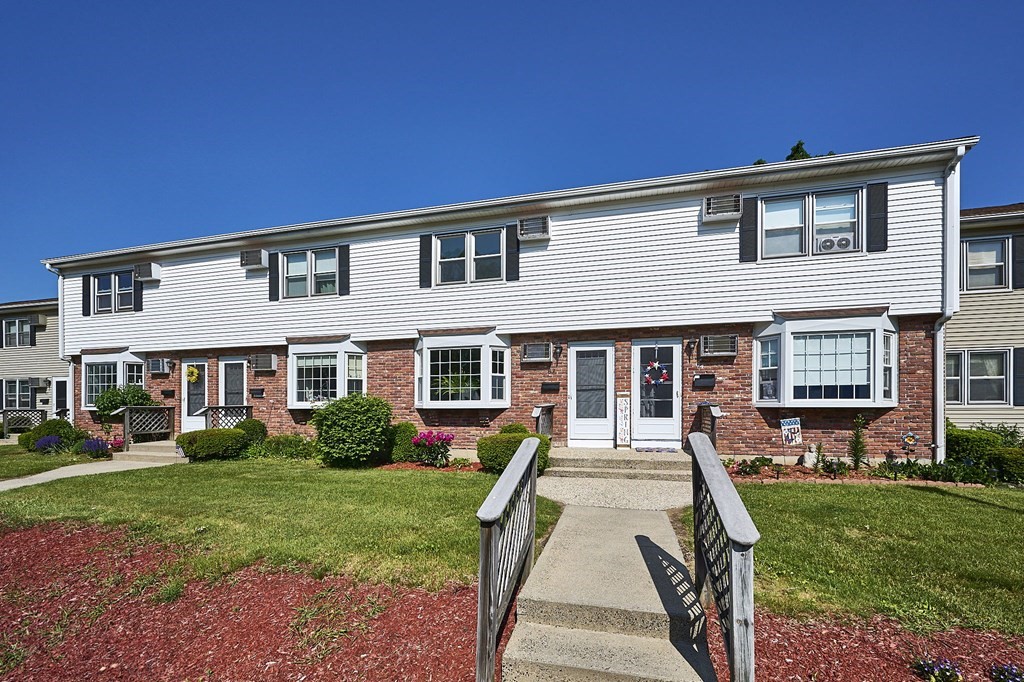 41 South Street, Unit 63 Easthampton, MA 01027 - Photo 1 of 34 a front view of a house with garden