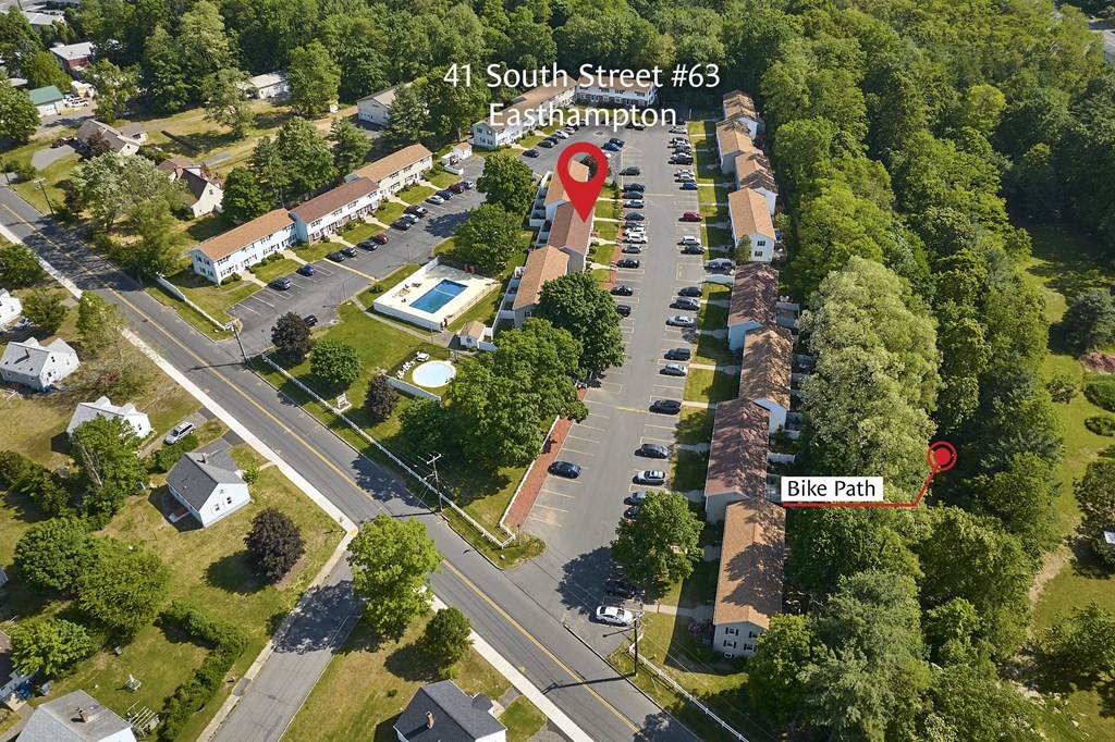 41 South Street, Unit 63 Easthampton, MA 01027 - Photo 30 of 34 an aerial view of swimming pool patio and trees