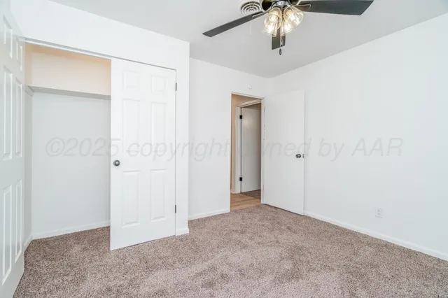 an empty room with fan