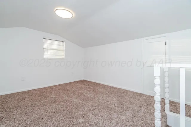 an empty room with a empty space and window