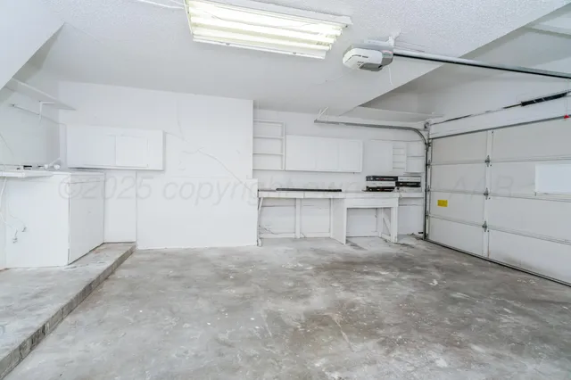 a view of a kitchen with appliances and cabinets