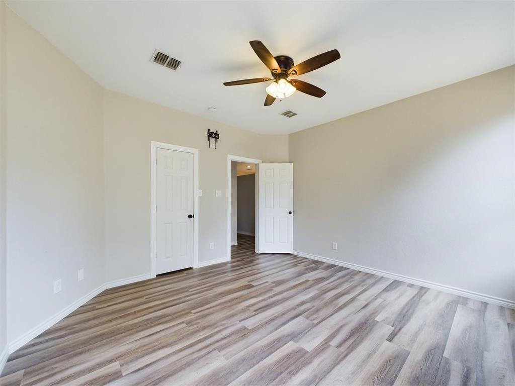 417 Indian Trail Road Roanoke, TX 76262 - Photo 12 of 19 a view of a big room with wooden floor and windows