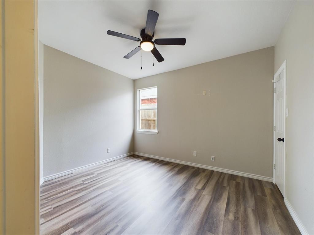 417 Indian Trail Road Roanoke, TX 76262 - Photo 16 of 19 a view of room with hardwood floor and ceiling fan