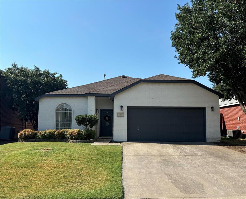 417 Indian Trail Road Roanoke, TX 76262 - Photo 2 of 19 a front view of house with yard and trees in the background