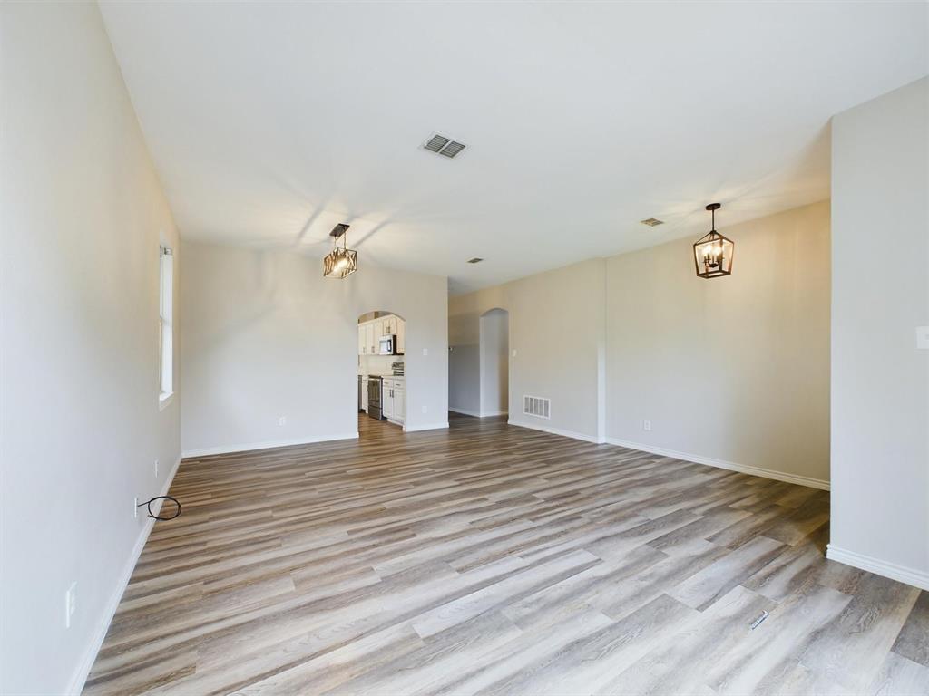 417 Indian Trail Road Roanoke, TX 76262 - Photo 3 of 19 a view of empty room with wooden floor and fan