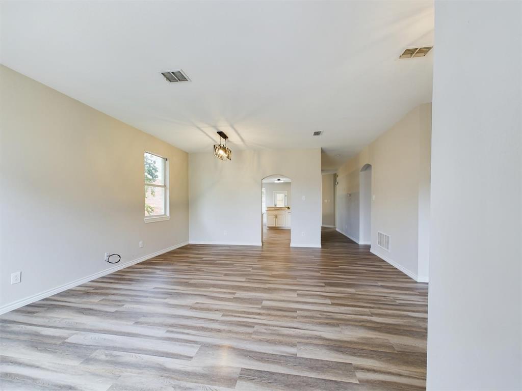 417 Indian Trail Road Roanoke, TX 76262 - Photo 4 of 19 a view of an empty room with a window