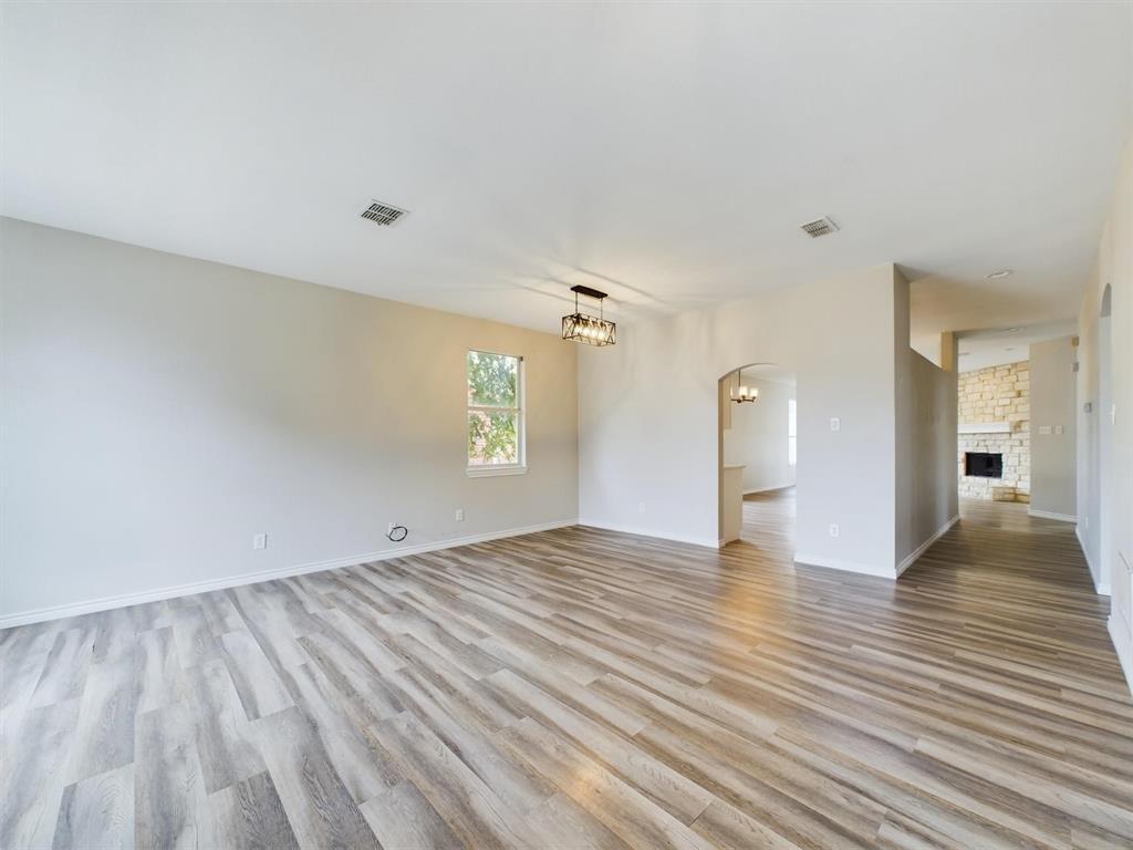 417 Indian Trail Road Roanoke, TX 76262 - Photo 5 of 19 a view of empty room with window and wooden floor