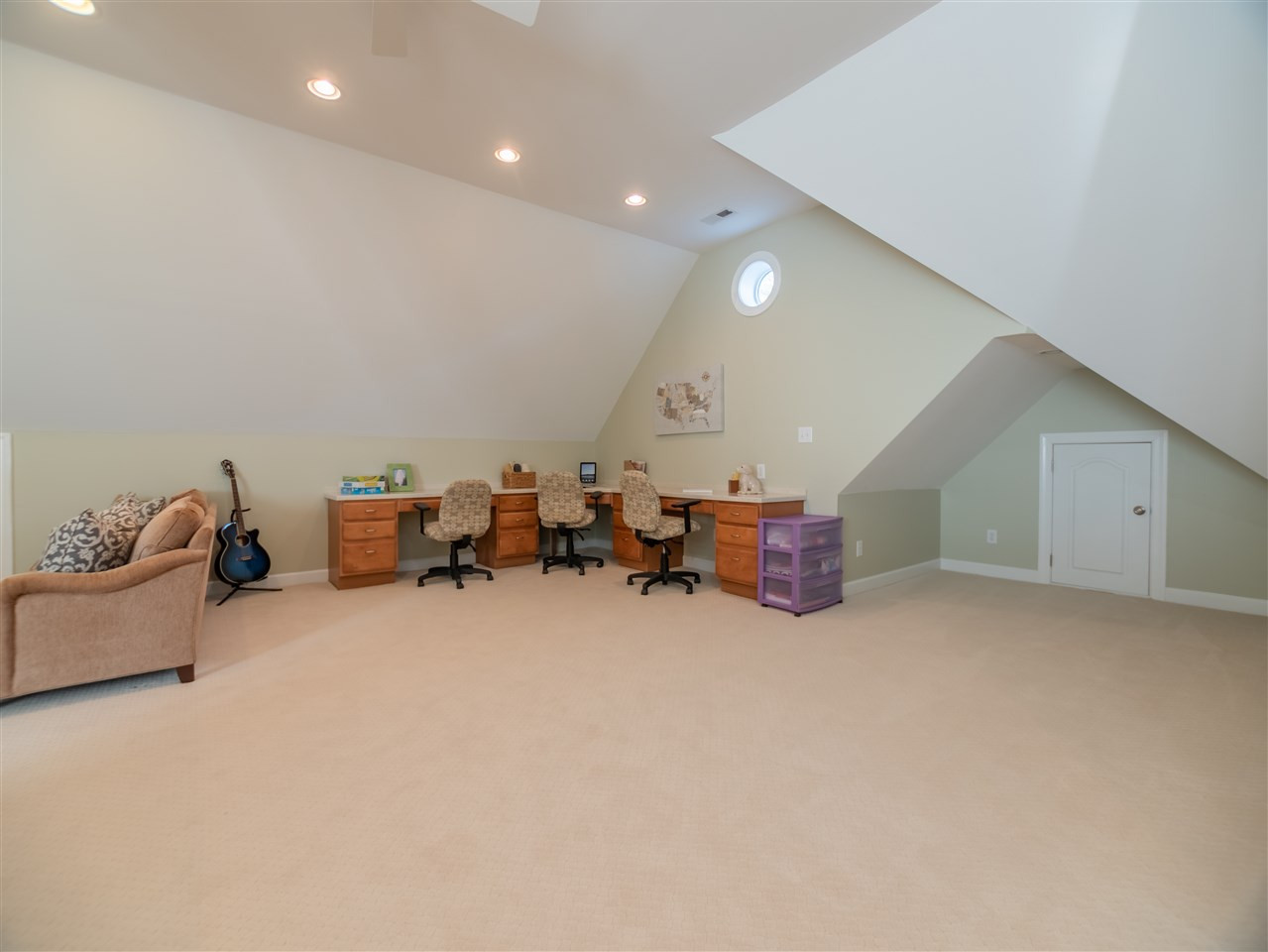 4016 White Chapel Way Raleigh, NC 27615 - Photo 23 of 30 Enormous bonus room with large dormer for natural light. The room also includes a built-in study area, separate craft/office area and full bath. A large walk-out attic area for additional storage is adjacent to this room.