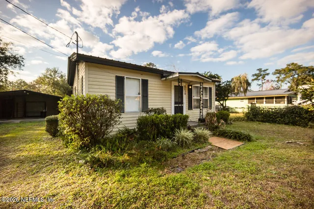 a front view of a house with garden