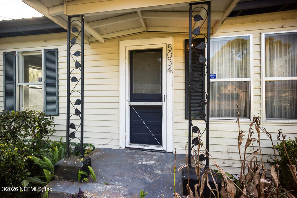 8034 Gordean Road Jacksonville, FL 32221 - Photo 16 of 37 a front view of a house with a porch