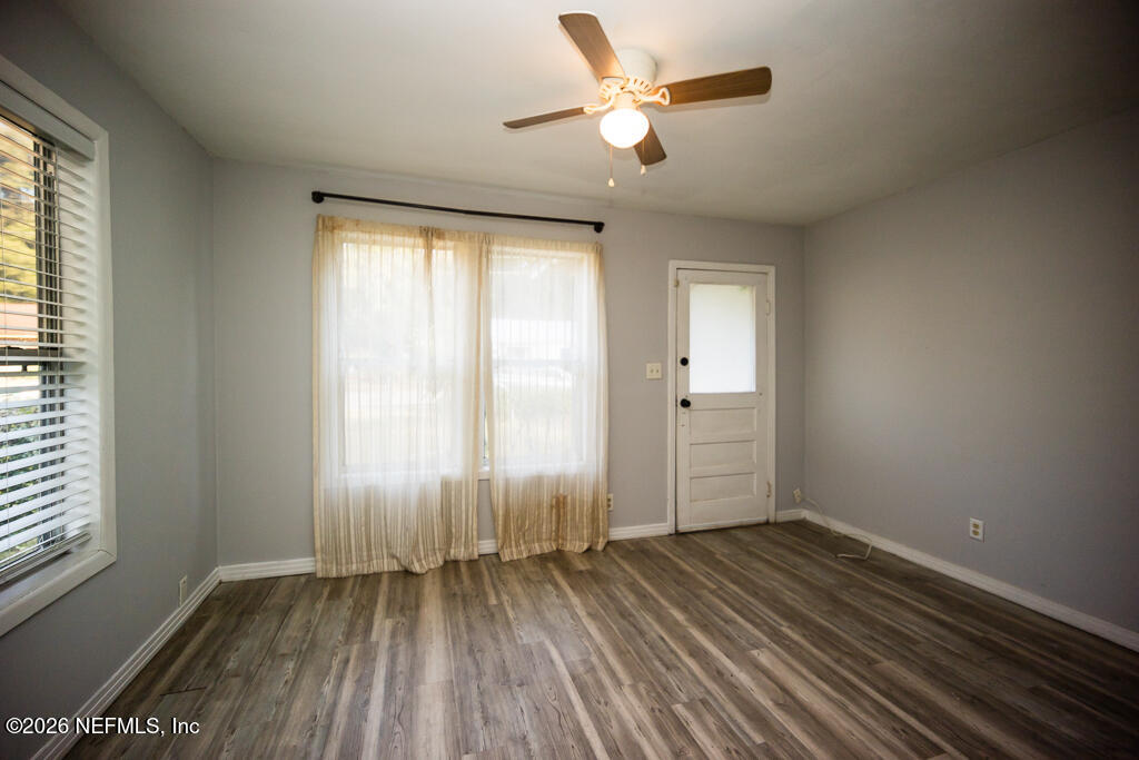 8034 Gordean Road Jacksonville, FL 32221 - Photo 18 of 37 wooden floor in an empty room with a window