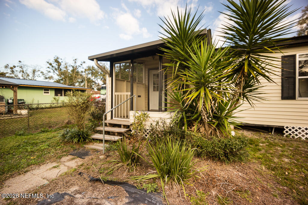8034 Gordean Road Jacksonville, FL 32221 - Photo 29 of 37 a house with palm tree in front of it