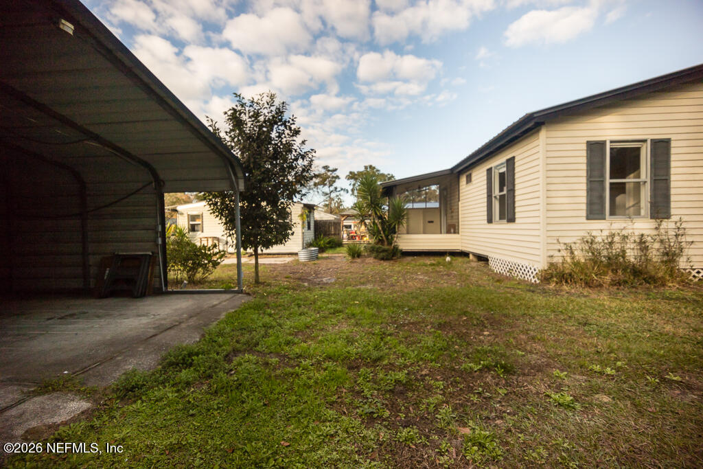 8034 Gordean Road Jacksonville, FL 32221 - Photo 31 of 37 a front view of a house with garden
