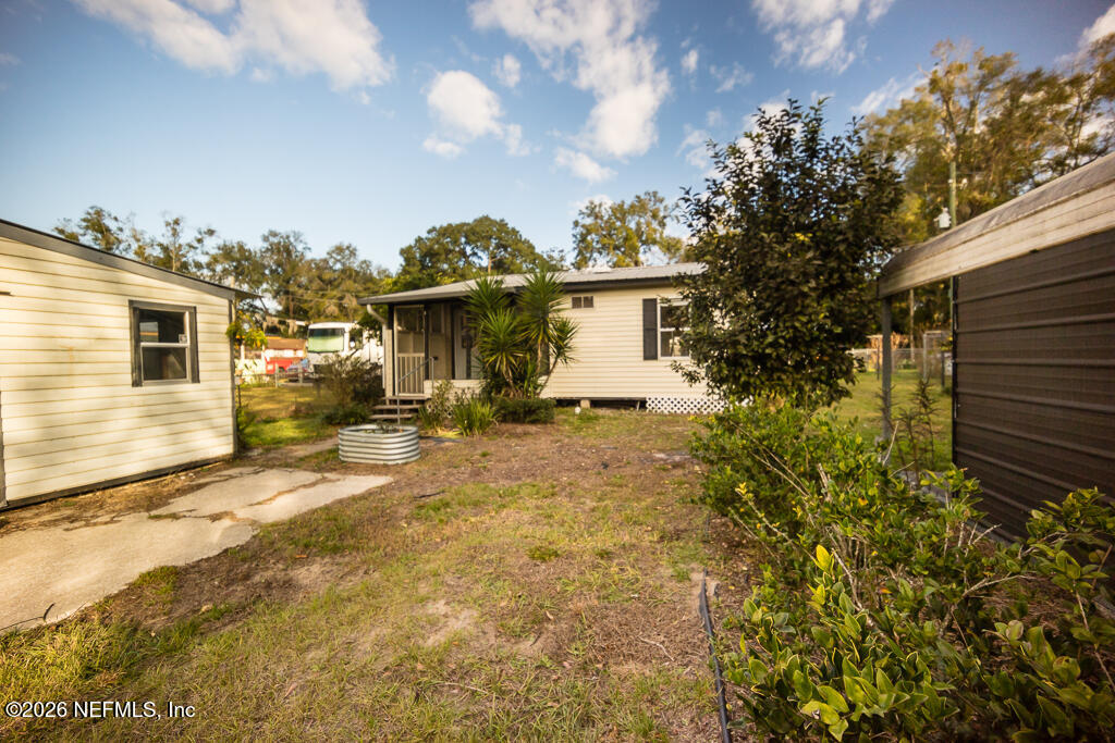 8034 Gordean Road Jacksonville, FL 32221 - Photo 33 of 37 a view of a house with a yard