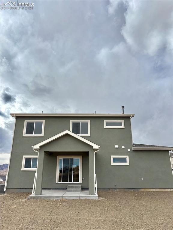 810 Keystone Loop Canon City, CO 81212 - Photo 13 of 13 a front view of a house with a yard
