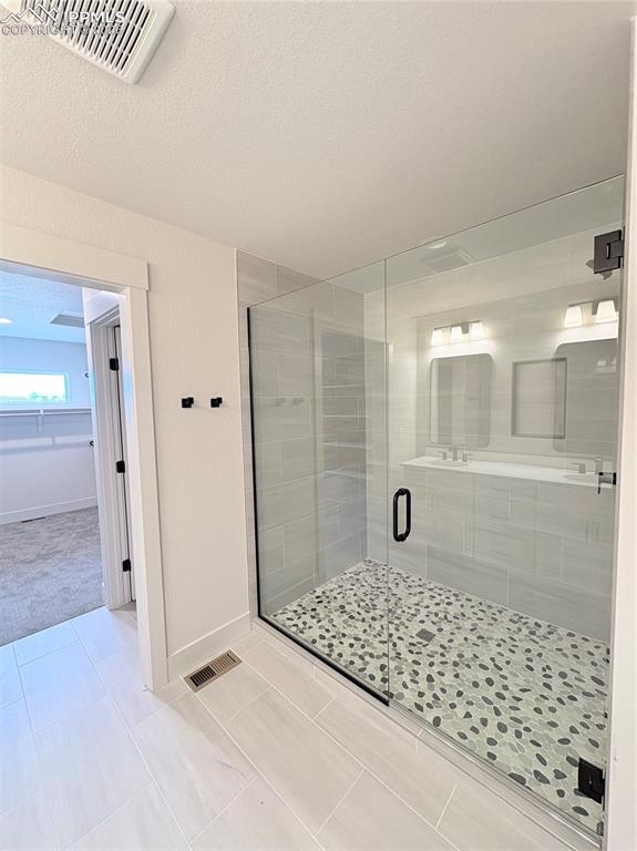 810 Keystone Loop Canon City, CO 81212 - Photo 4 of 13 a bathroom with a granite countertop sink a mirror and shower