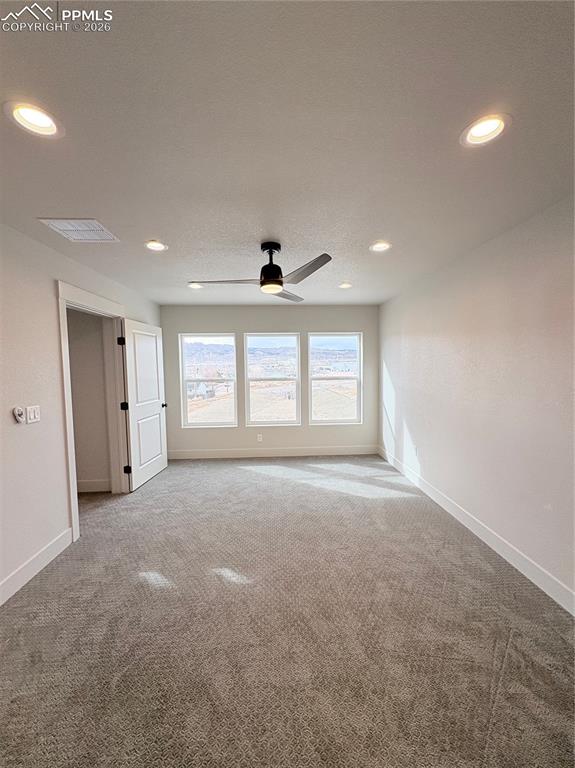 810 Keystone Loop Canon City, CO 81212 - Photo 8 of 13 a view of a livingroom with a ceiling fan and window