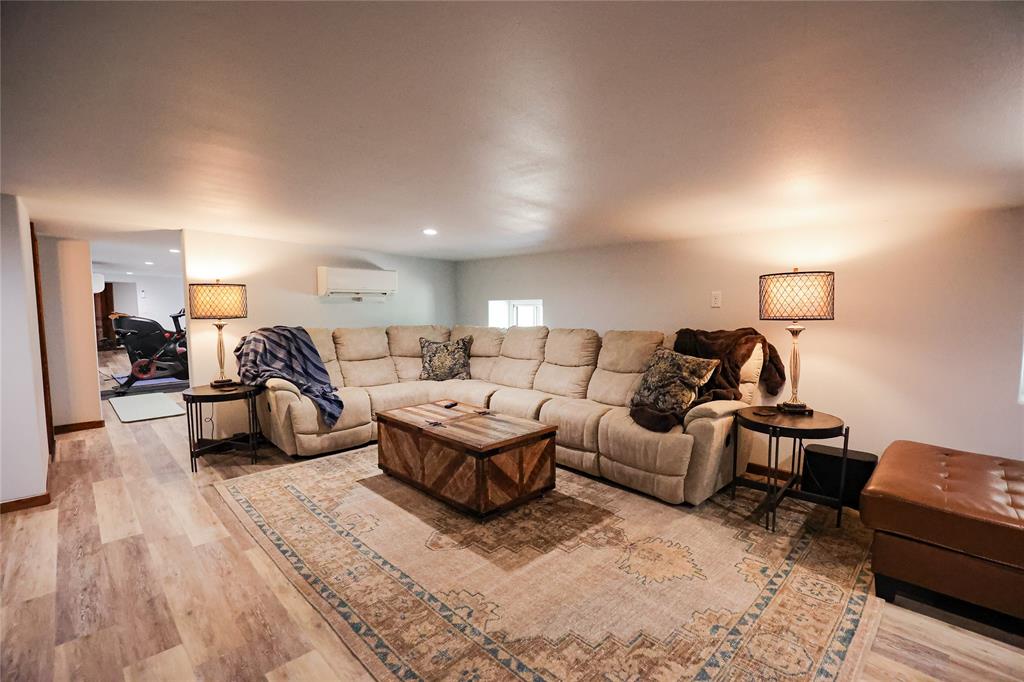 1250 County Road Brady, TX 76825 - Photo 25 of 40 a living room with furniture and a wooden floor