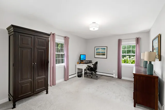 a dining room with furniture and window
