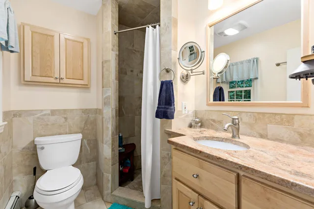 a backyard of a house with a table and chairs