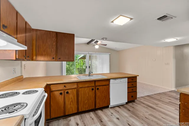 a kitchen with a sink and cabinets