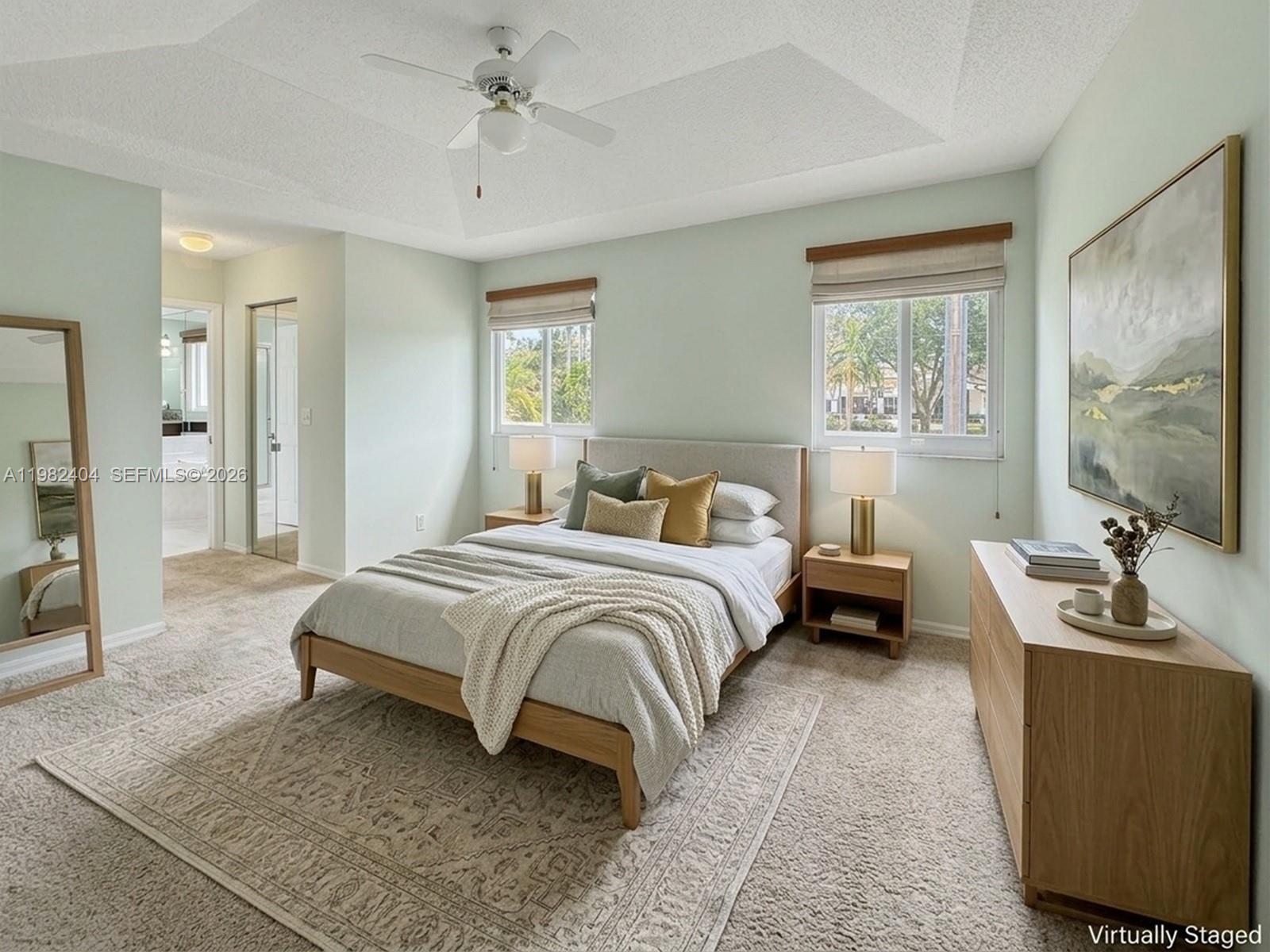 2640 Rampart Way North Cooper City, FL 33026 - Photo 26 of 58 a bedroom with a bed a couch and a window