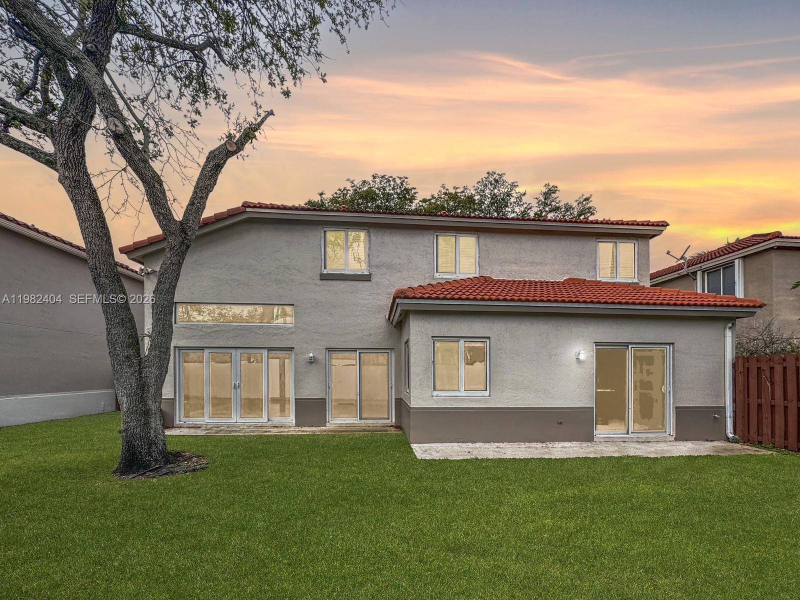 2640 Rampart Way North Cooper City, FL 33026 - Photo 36 of 58 a front view of a house with a garden