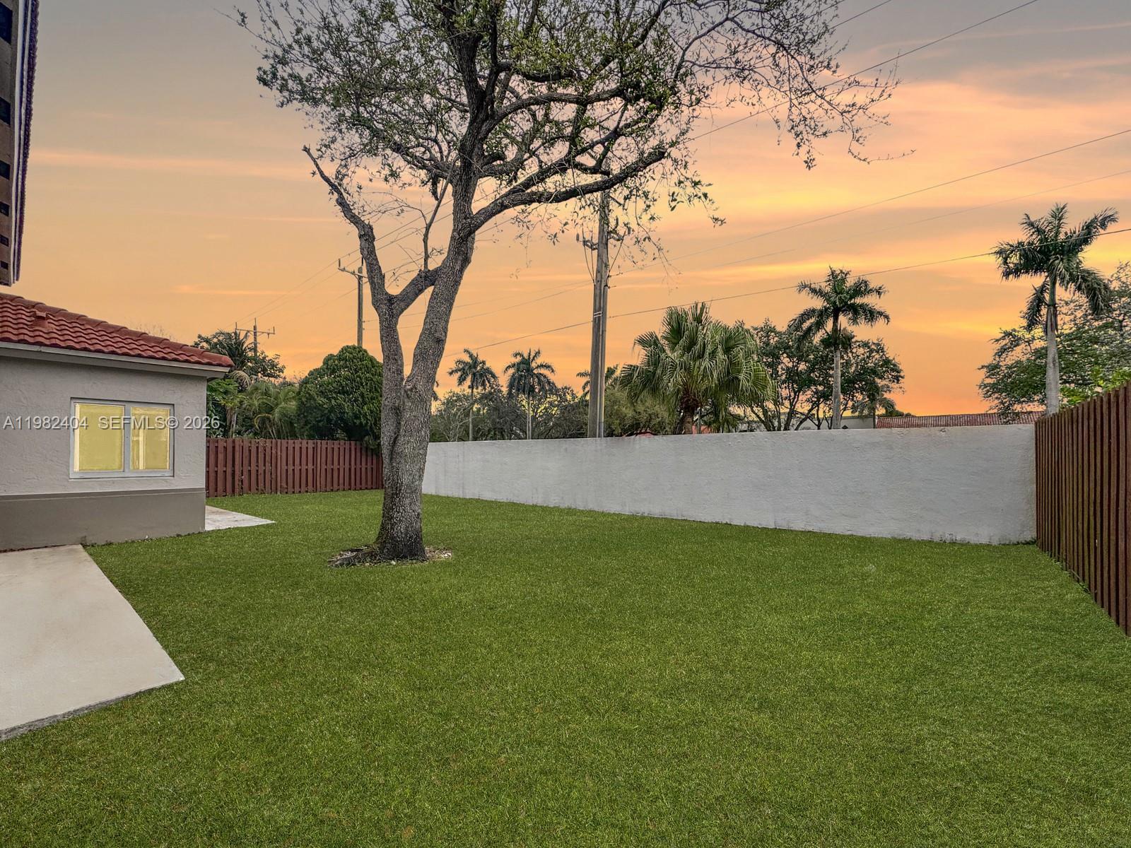 2640 Rampart Way North Cooper City, FL 33026 - Photo 39 of 58 a view of a yard with a tree