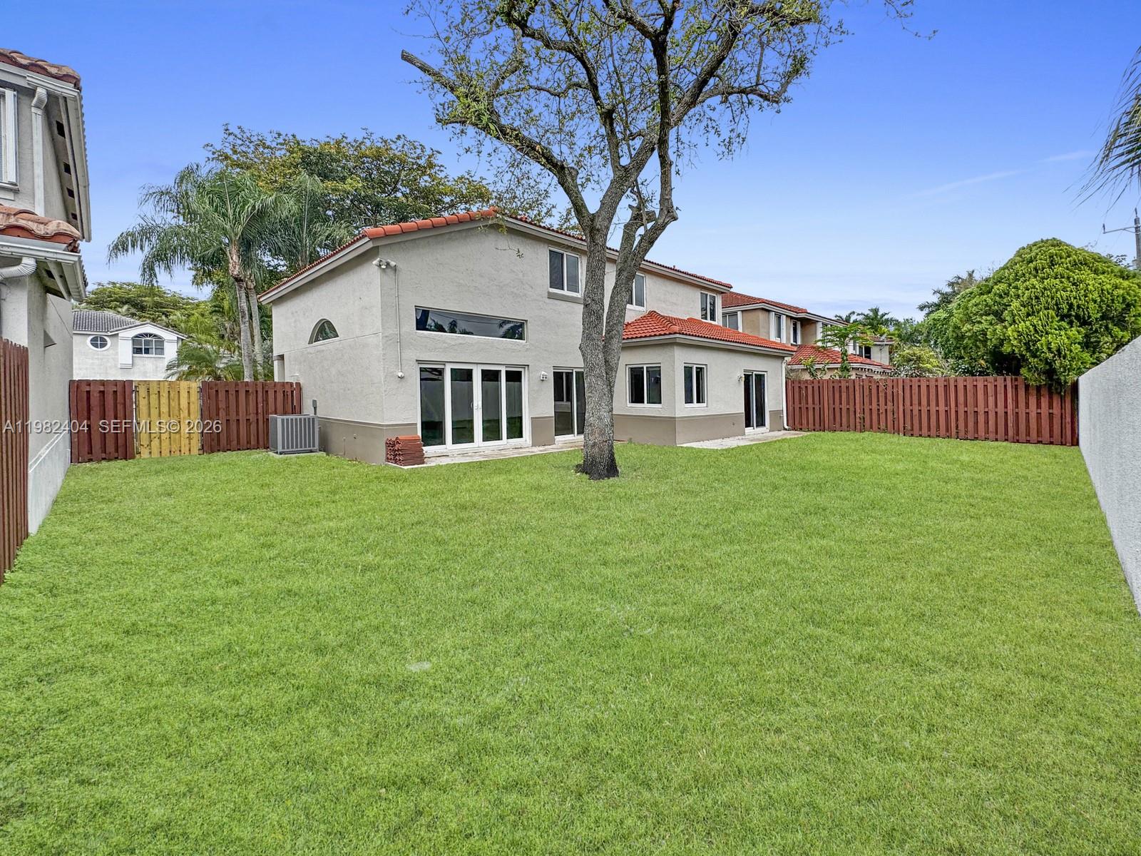 2640 Rampart Way North Cooper City, FL 33026 - Photo 40 of 58 a front view of house with yard and green space