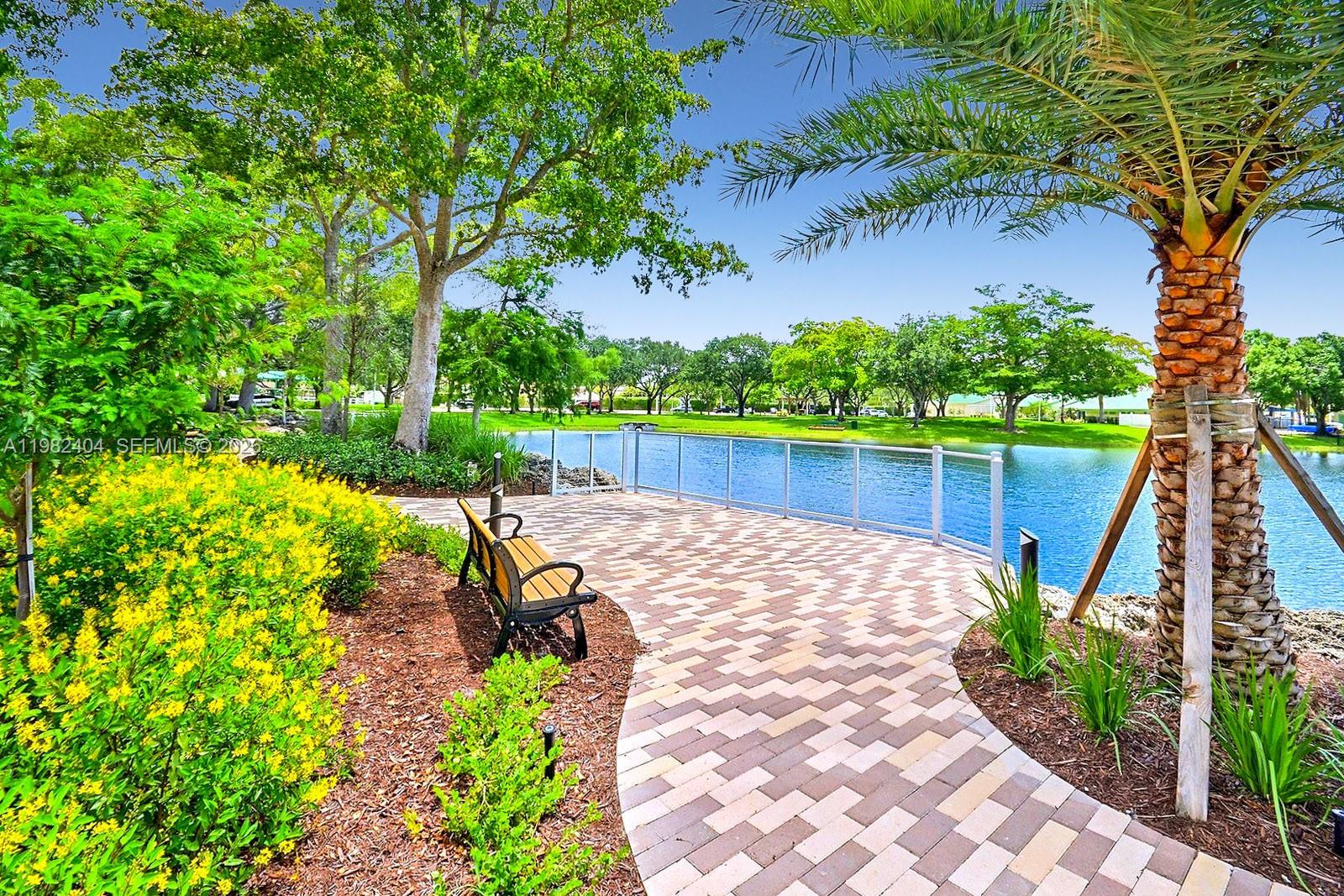 2640 Rampart Way North Cooper City, FL 33026 - Photo 53 of 58 a view of a backyard with plants and a patio