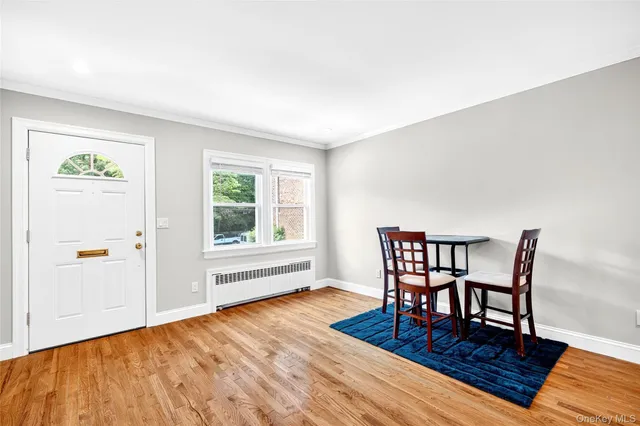 a view of a livingroom with furniture and wooden floor