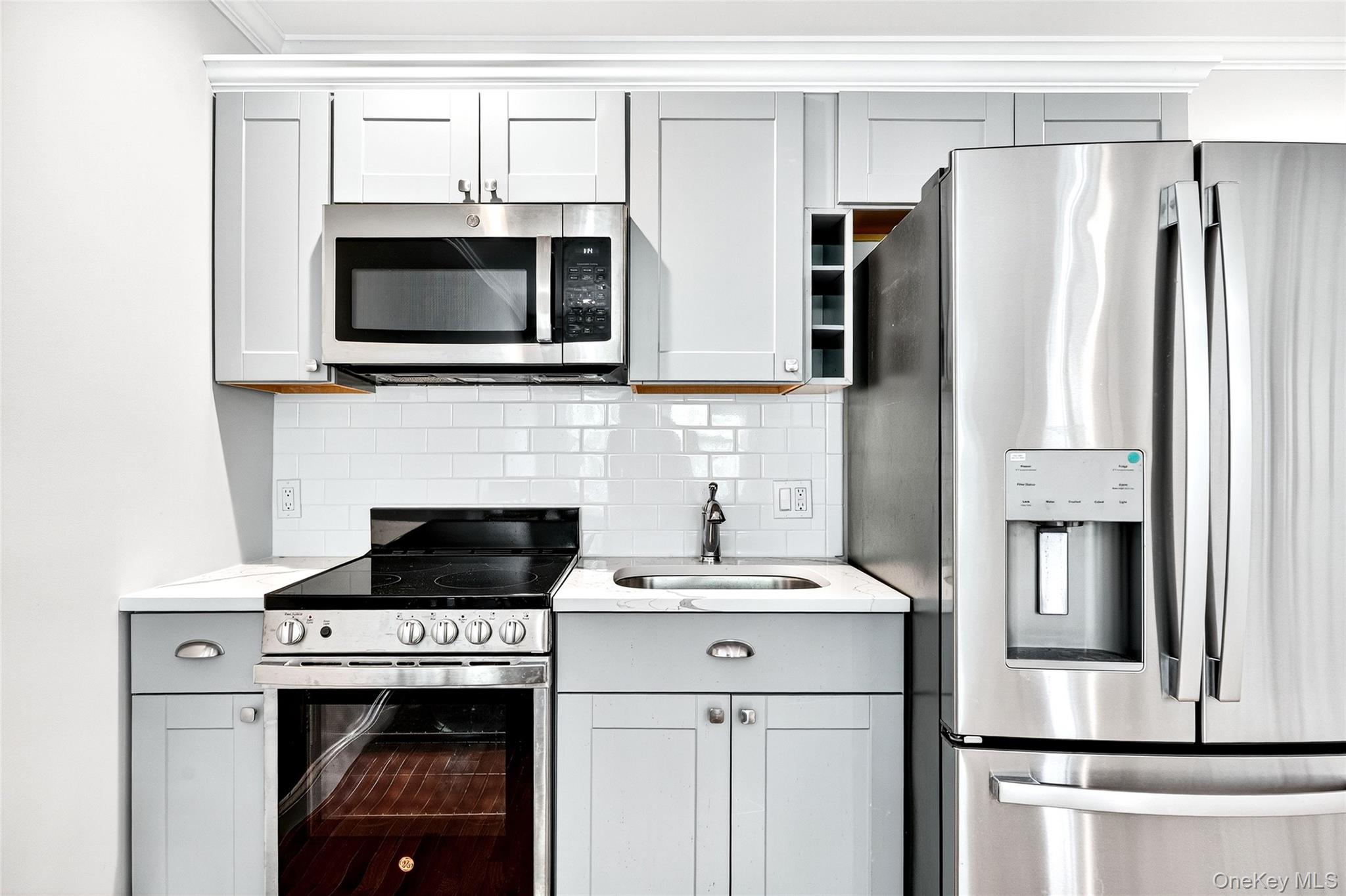 24 Wappanocca Avenue, Unit I Rye, NY 10580 - Photo 13 of 26 a kitchen with stainless steel appliances a stove microwave and refrigerator