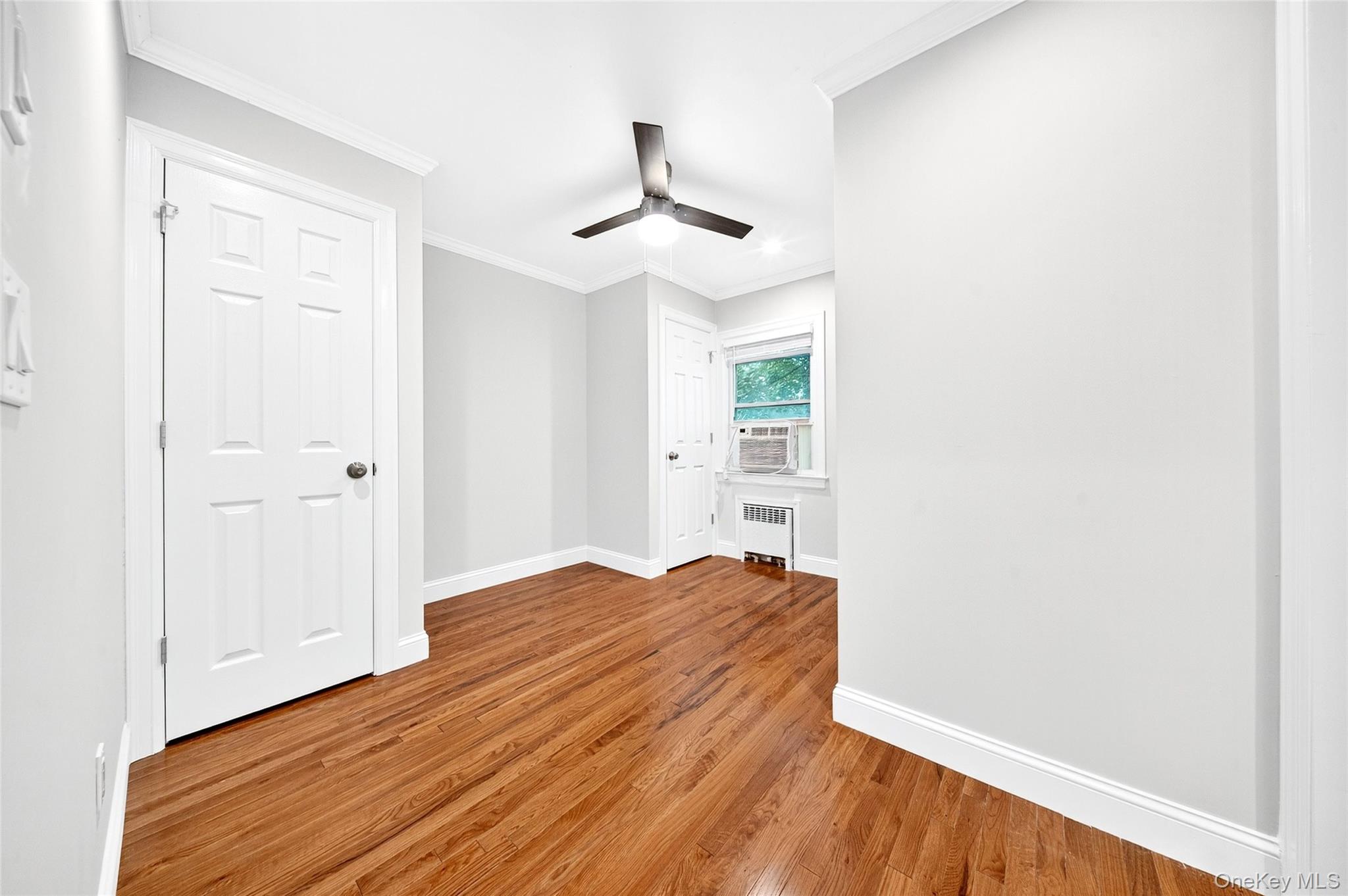 24 Wappanocca Avenue, Unit I Rye, NY 10580 - Photo 16 of 26 a view of empty room with wooden floor