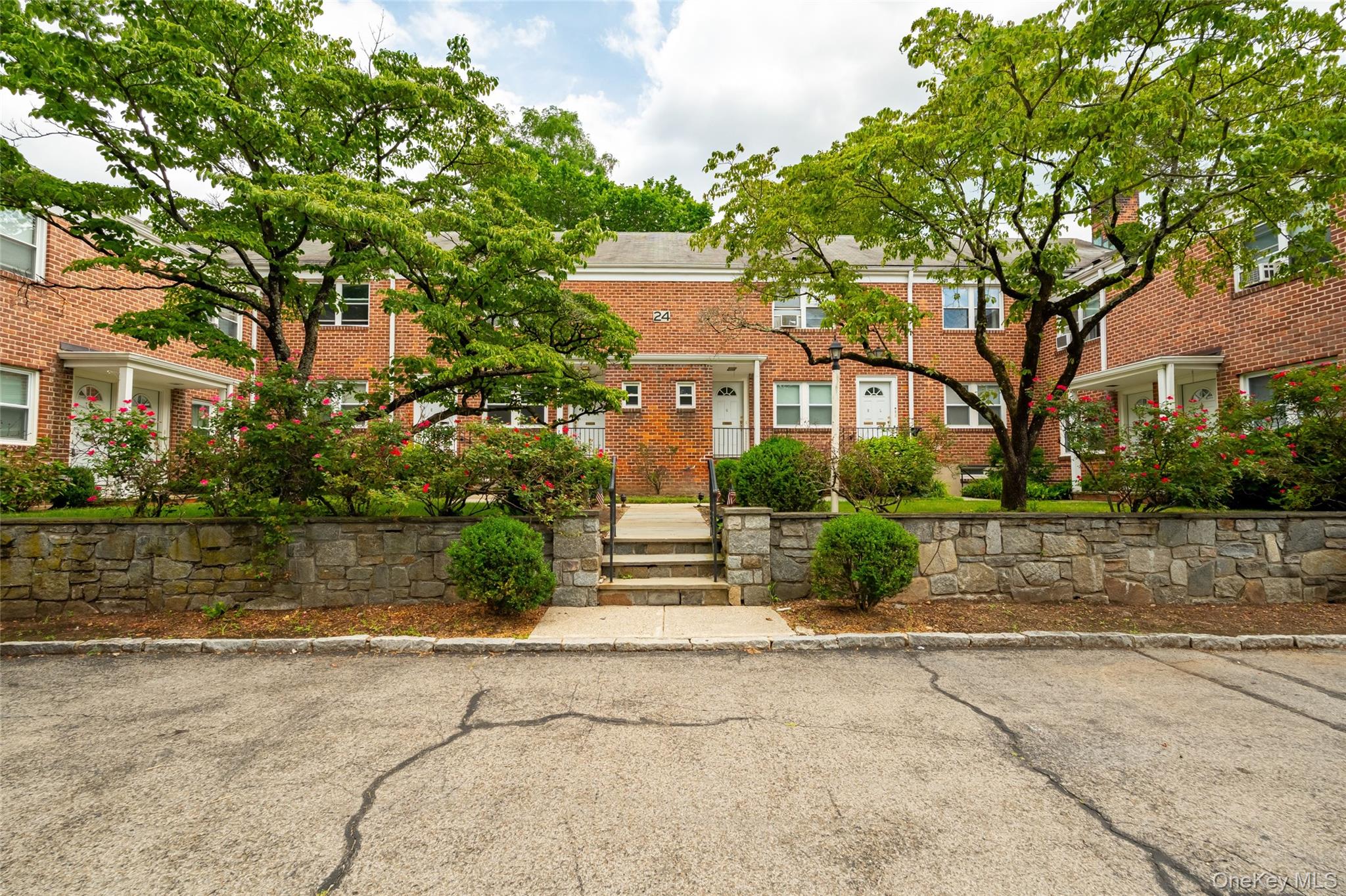 24 Wappanocca Avenue, Unit I Rye, NY 10580 - Photo 2 of 26 a front view of a house with a yard