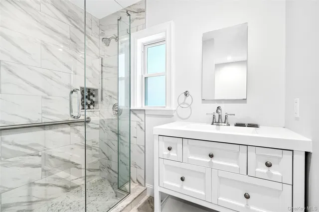 a bathroom with a sink and mirror