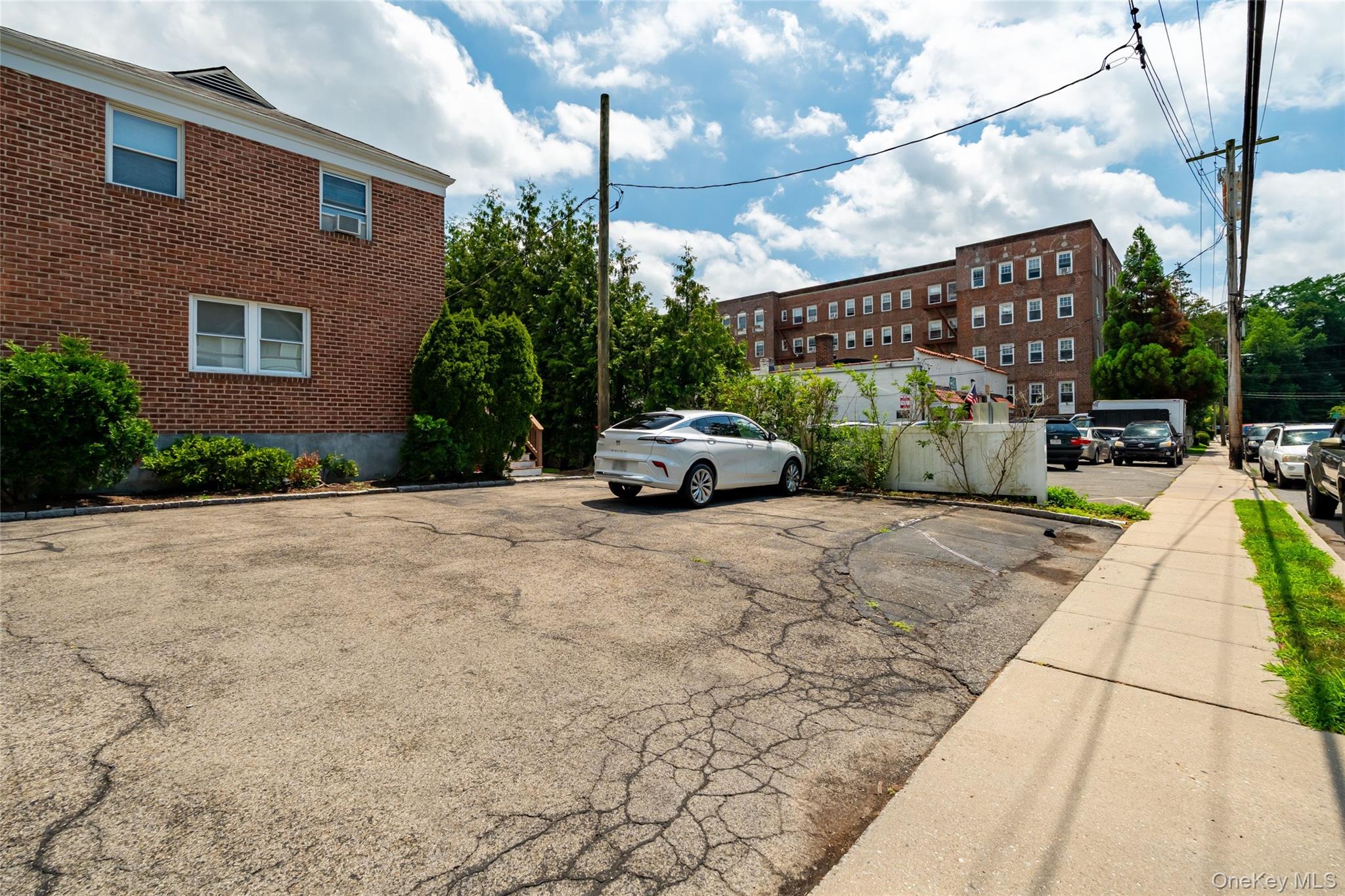 24 Wappanocca Avenue, Unit I Rye, NY 10580 - Photo 23 of 26 a car parked on the side of the road