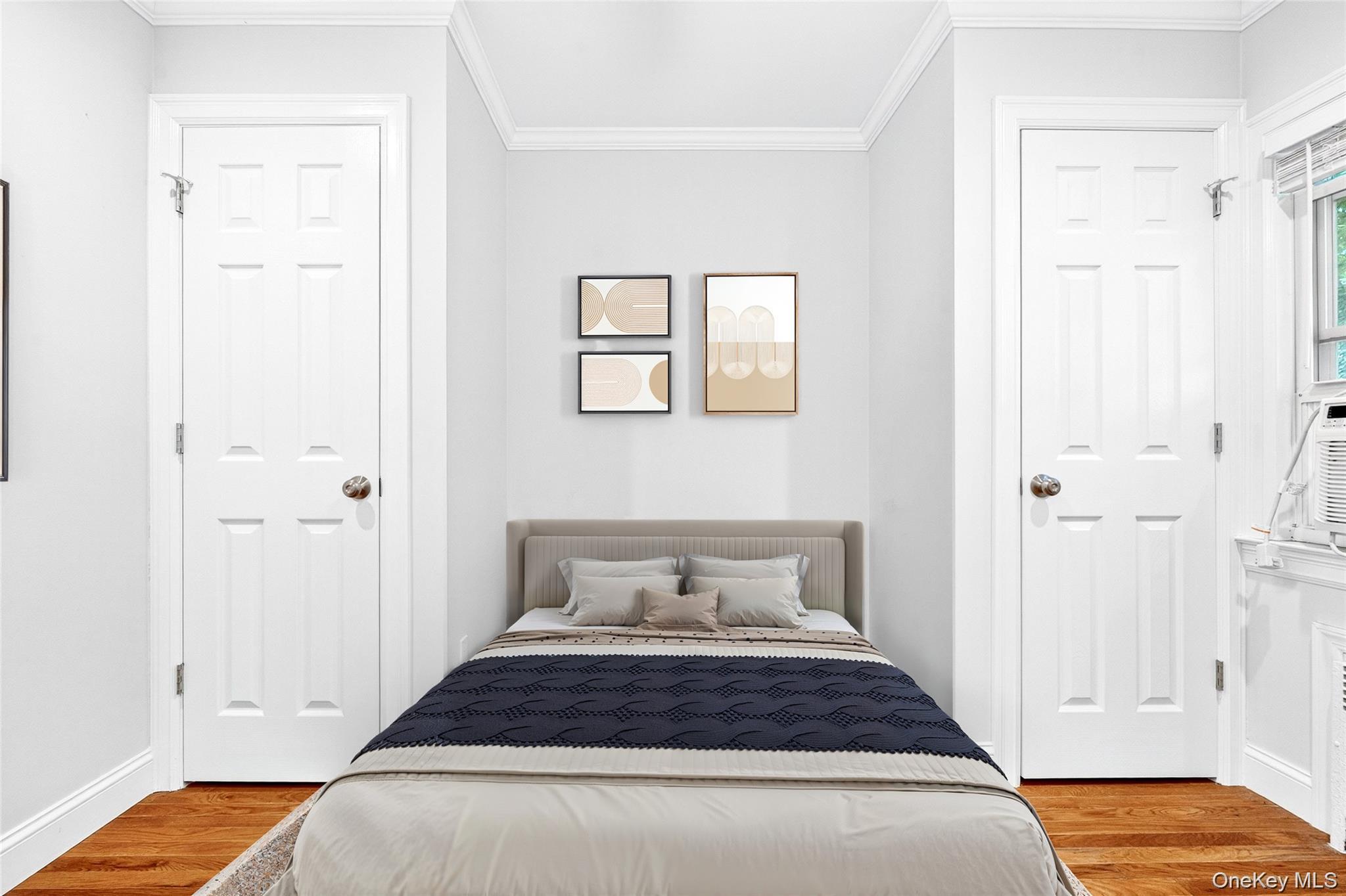 24 Wappanocca Avenue, Unit I Rye, NY 10580 - Photo 25 of 26 a bedroom with a bed and wooden floor