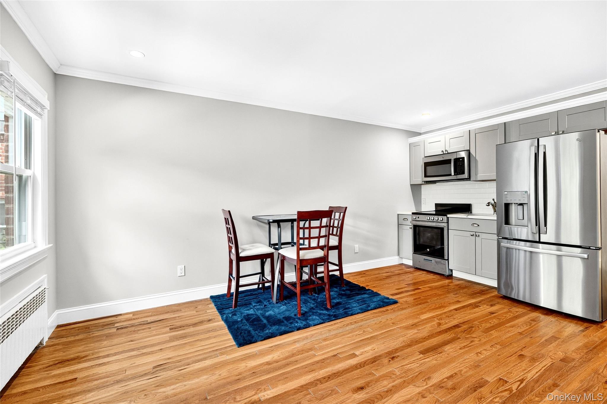 24 Wappanocca Avenue, Unit I Rye, NY 10580 - Photo 7 of 26 a kitchen with granite countertop a refrigerator stove top oven and stainless steel appliances