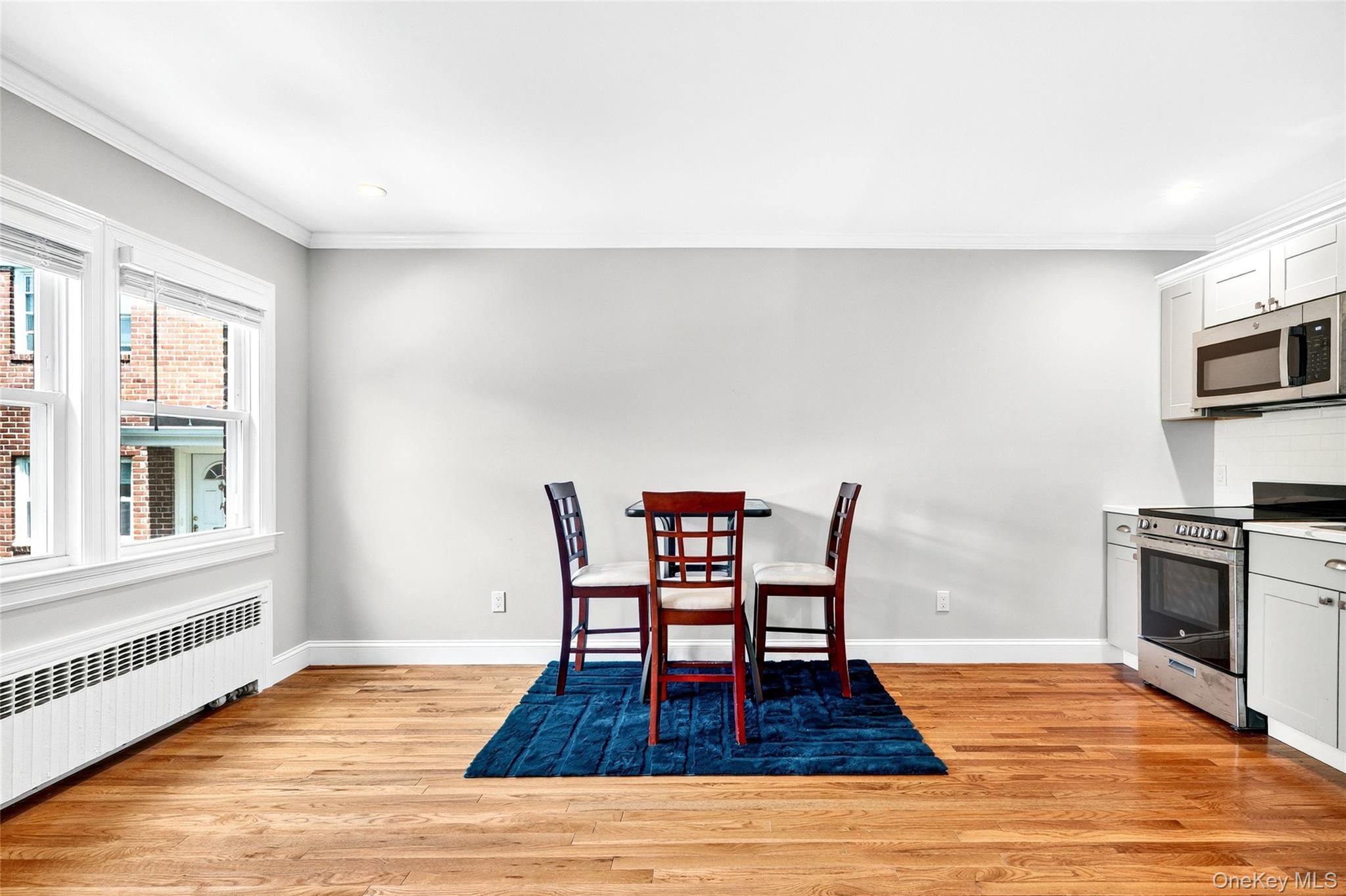 24 Wappanocca Avenue, Unit I Rye, NY 10580 - Photo 10 of 26 a dining room with furniture a rug and wooden floor