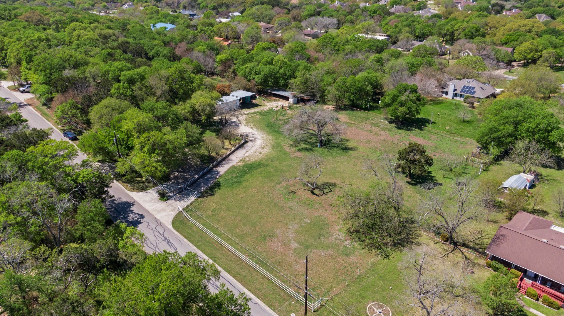 20 Pillow Road Sunset Valley, TX 78745 - Photo 4 of 17 an aerial view of residential house with outdoor space and trees all around