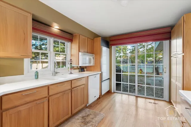 a view of a kitchen with a sink and a window